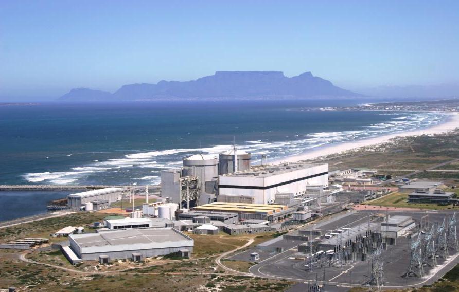 Aerial view of a power plant on the coast of a body of water